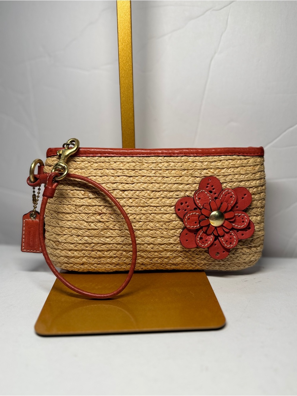 Coach Natural Straw Wristlet with orange poppy straw leather Flower appliqué